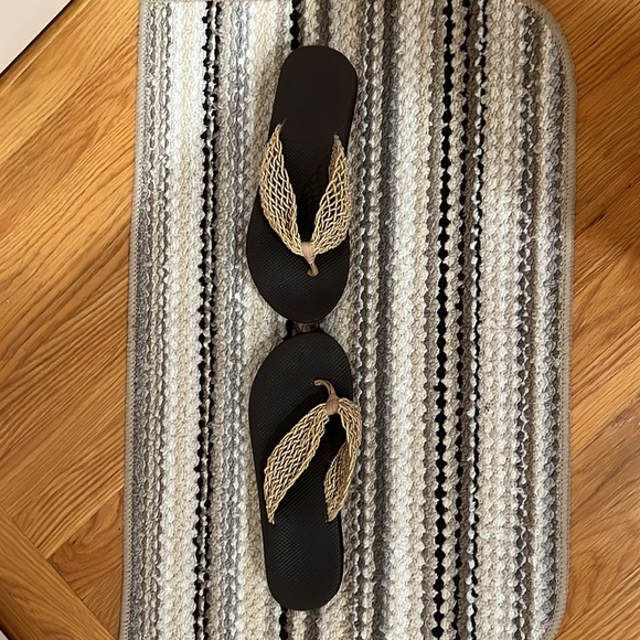 Woman’s, brown flip flops with gold colored trim. Size 8 1/2. Gently used. - Picture 2 of 3